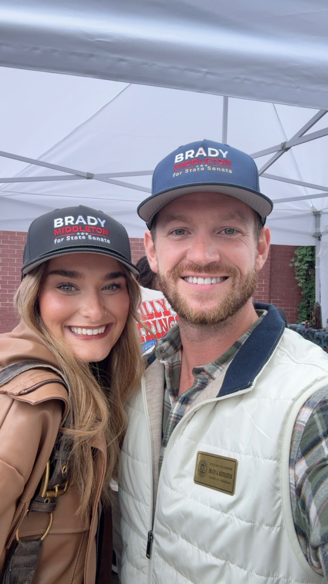 Brady Middleton with a supporter, both wearing campaign hats